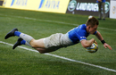 Nick Tompkins dives over for a try