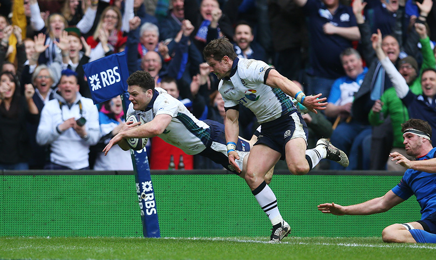 Duncan Taylor of Scotland dives over to score his team's second try