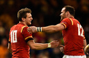 Dan Biggar of Wales is congratulated by teammate Jamie Roberts after scoring his team's second try
