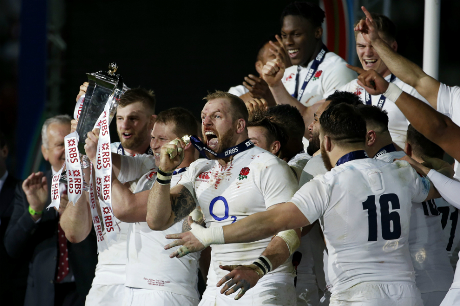 Dylan Hartley holds the trophy as England celebrate winning the Grand Slam