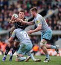 Henry Slade of Exeter Chiefs is tackled by Jamie Gibson of Northampton Saints