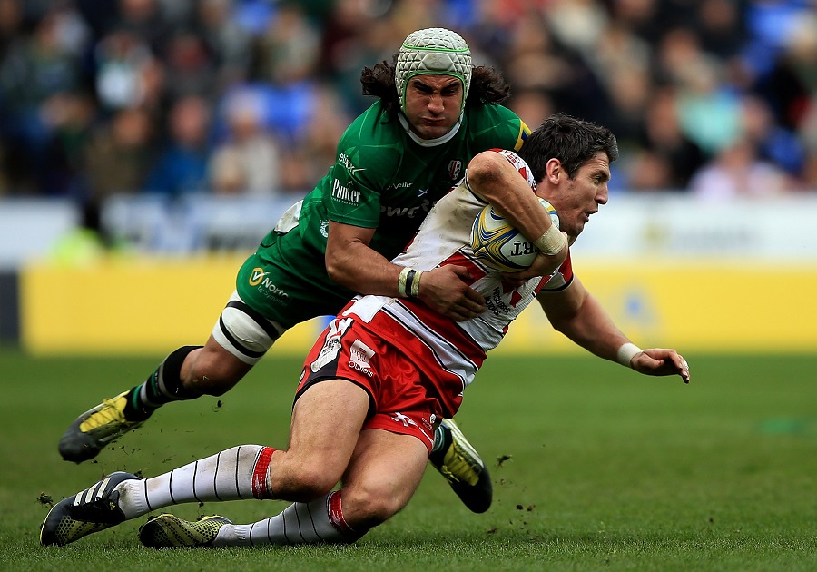 James Hook of Gloucester is tackled by Blair Cowan of London Irish 