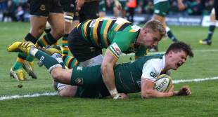  Freddie Burns of Leicester grimaces as Harry Mallinder falls on him as he scores a try during the Aviva Premiership match between Northampton Saints and Leicester Tigers at Franklin's Gardens on April 16, 2016 in Northampton, England. 