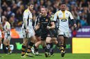 Gareth Steenson (C)  of Exeter Chiefs celebrates his sides second try as Elliot Daly (L) and Charles Piutau (R) of Wasps look on