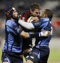 Kieran Read of the Crusaders is tackled by the Bulls' Victor Matfield and Bryan Habana of the Bulls during the round eight Super 14 match between the Crusaders and the Bulls at AMI Stadium