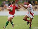 Ifan Evans of Wales looks to break past the Tonga defence
