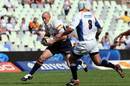 Brumbies centre Stirling Mortlock takes on the Cheetahs defence