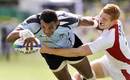 Fiji's Seremaia Burotu reaches out for the line