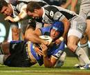 Western Force lock Nathan Sharpe is shackled by the Hurricanes' defence