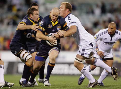 The Brumbies' Stirling Mortlock runs at the Stormers' defence