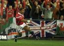 Jason Robinson celebrates his try for the Lions