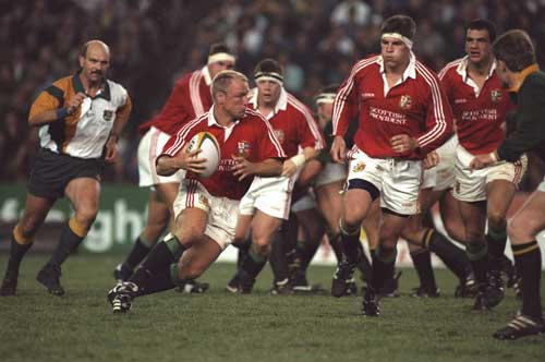 Neil Back carries the ball forward for the Lions