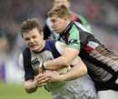 Leinster centre Brian O'Driscoll is tackled by Harlequins' David Strettle
