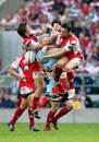 Cardiff Blues' Leigh Halfpenny and Gloucester Rory Lawson and Ryan Lamb contest a high ball