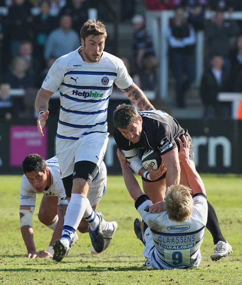 Newcastle's Tom May takes on Bath's Michael Claassens