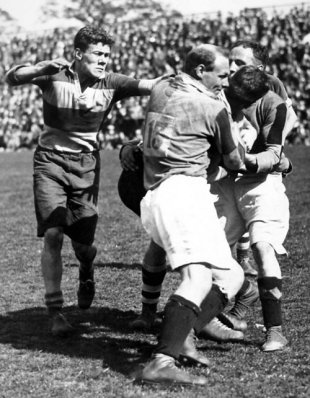 Wavell Wakefield is dispossessed during the Middlesex Sevens semi final between Harlequins and Old Millhillians, Twickenham, May 19, 1928