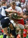 England's Tom Croft is tackled by Scotland's Chris Paterson