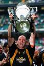 London Wasps' Lawrence Dallaglio celebrates with the Guinness Premiership trophy