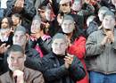 Fans at the Stade Ernest Wallon wear Fabien Pelous masks