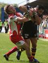 Wasps' Riki Flutey holds off Gloucester's Rory Lawson to score a try