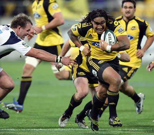 Hurricanes centre Ma'a Nonu breaks clear of the Blues defence
