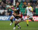 Northampton's Ben Foden is tackled by Saracens' Rodd Penney