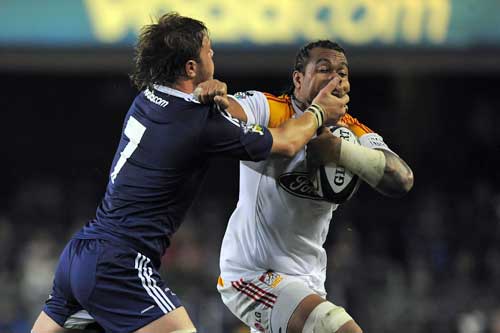 Chiefs No.8 Sione Lauaki is tackled by the Stormers' Duane Vermeulen