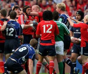 Munster's Alan Quinlan and Leinster's Leo Cullen are separated by team mates
