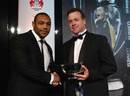 Jordan Turner-Hall of Harlequins receives the award for Discovery of the Season from Land Rover's Bruce Robertson
