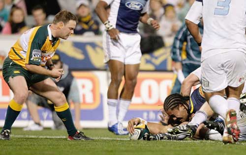 The Brumbies' Sitaleki Timani touches down to score a try