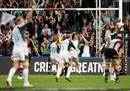 London Irish's Mike Catt celebrates scoring a try