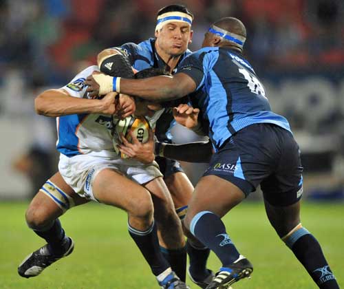 The Bulls' Pierre Spies and Chiliboy Ralepelle gang up on the Cheetahs' Hennie Daniller 