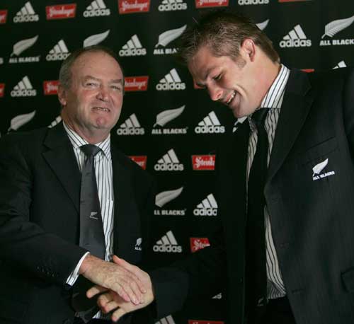 New All Blacks skipper Richie McCaw shakes hands with coach Graham Henry