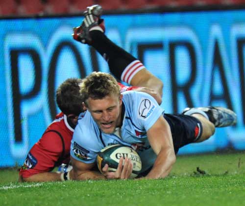 The Waratahs' Lachlan Turner touches down for try