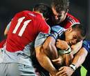 The Blues' Rudi Wulf is wrapped up by the Crusaders' defence