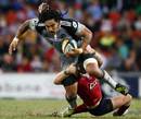 Hurricanes centre Ma'a Nonu takes on the Reds defence