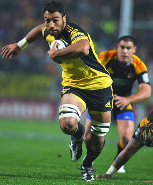 The Hurricanes' Victor Vito takes on the Chiefs' defence