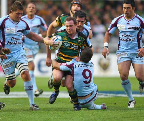 Northampton's Paul Diggin is tackled by Bourgoin's Morgan Parra