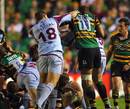Bourgoin's Thomas Genevois lands a punch on Northampton's Courtney Lawes