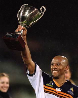 The Brumbies' George Gregan lifts the Super 12 silverware following his side's victory over The Sharks, ACT Brumbies v The Sharks, Super 12 Final, Canberra Stadium, Canberra, Australia, May 25, 2001