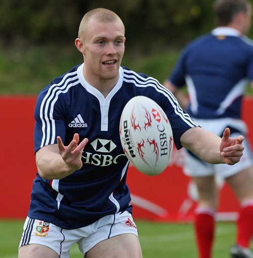 Keith Earls passes the ball during a Lions training session 