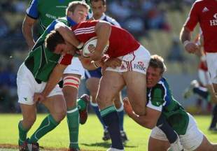 Jamie Roberts is tackled by two defenders in the match between Royal XV and British & Irish Lions, Royal Bakofeng Stadium, Rustenburg, South Africa, May 30, 2009

