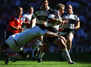 Justin Marshall of the Barbarians is tackled by Matt Banahan in the match between England and the Barbarians, Twickenham, May 30