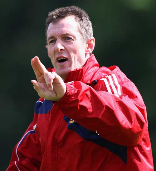 Lions assistant coach Rob Howley offers some instruction