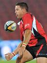 Lions fly-half Andre Pretorius off loads the ball
