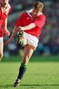 Lions fly-half Rob Andrew kicks for position