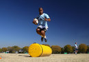 South Africa's JP Pietersen jumps over the tackle bags 