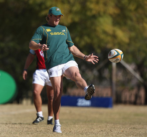 South Africa's assistant coach, Percy Mongomery kicks the ball upfield