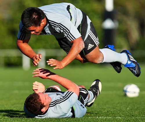 Keven Mealamu leaps over the top of Kieran Read during an All Blacks training session