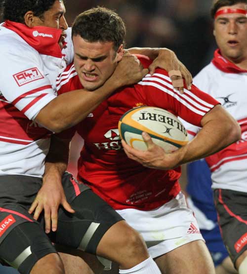 The Lions' Jamie Roberts stretches the Golden Lions' defence